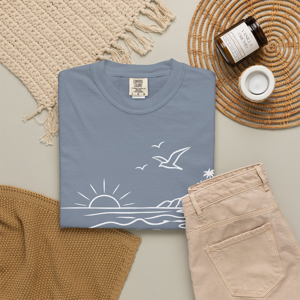 Folded Blue Jean shirt with the text "Malibu Oase."