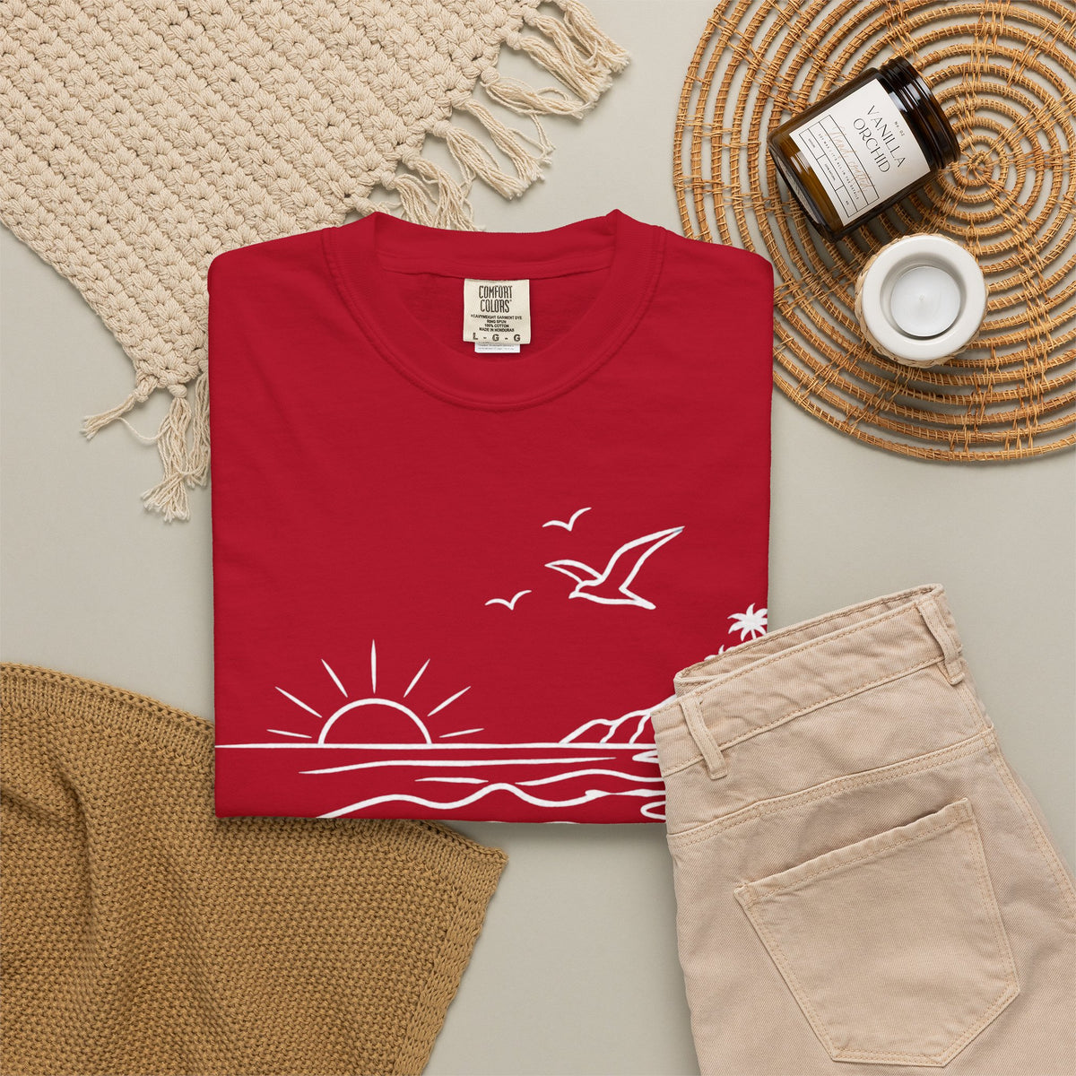 Folded Red shirt with the text "Malibu Oase."