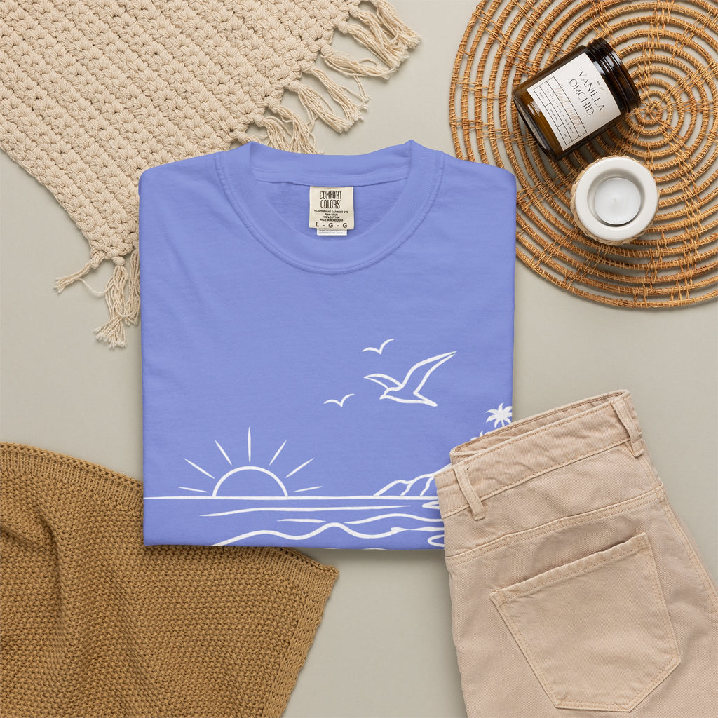 Folded Flo Blue shirt with the text "Malibu Oase."