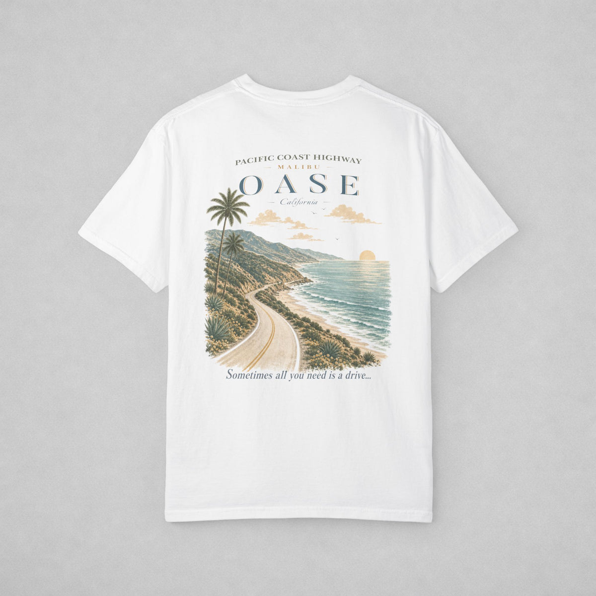 White. Backside of T-shirt. Scenic view of PCH.  Caption: "Sometimes all you need is a drive"