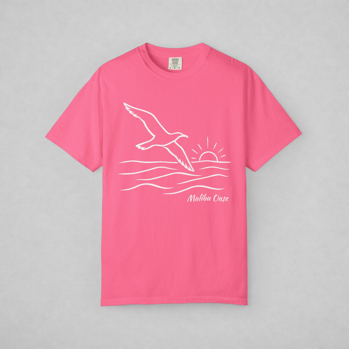 Crunchberry.  Short-sleeve t-shirt with a white line art graphic of a flying seagull, waves, a rising sun, and the text Malibu Oase' on the front, displayed flat against a neutral gray background.