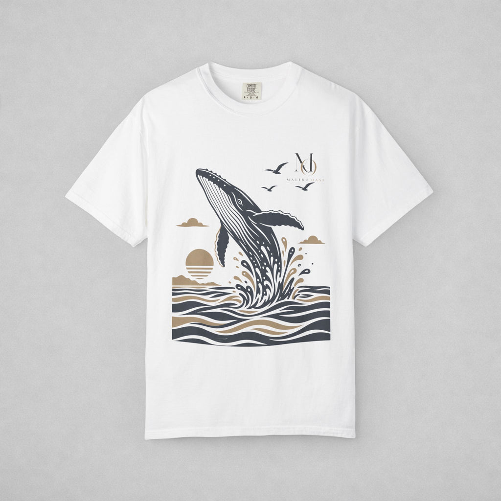 White. Short-sleeve crewneck t-shirt with a graphic print of a whale jumping out of the water, birds, and a sun, displayed on a neutral gray background.