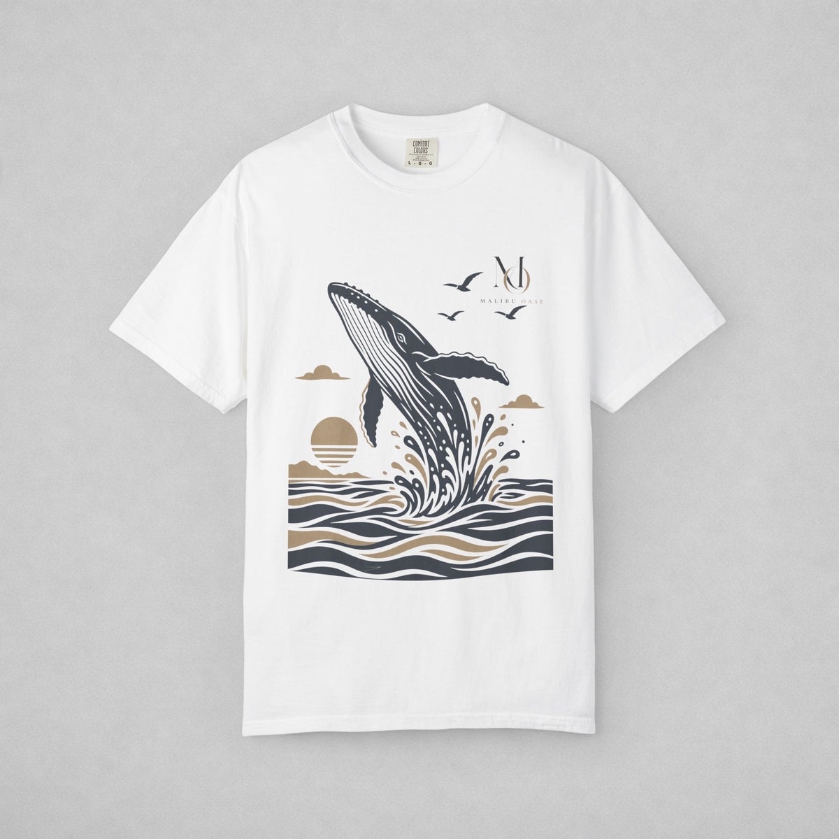 White. Short-sleeve crewneck t-shirt with a graphic print of a whale jumping out of the water, birds, and a sun, displayed on a neutral gray background.