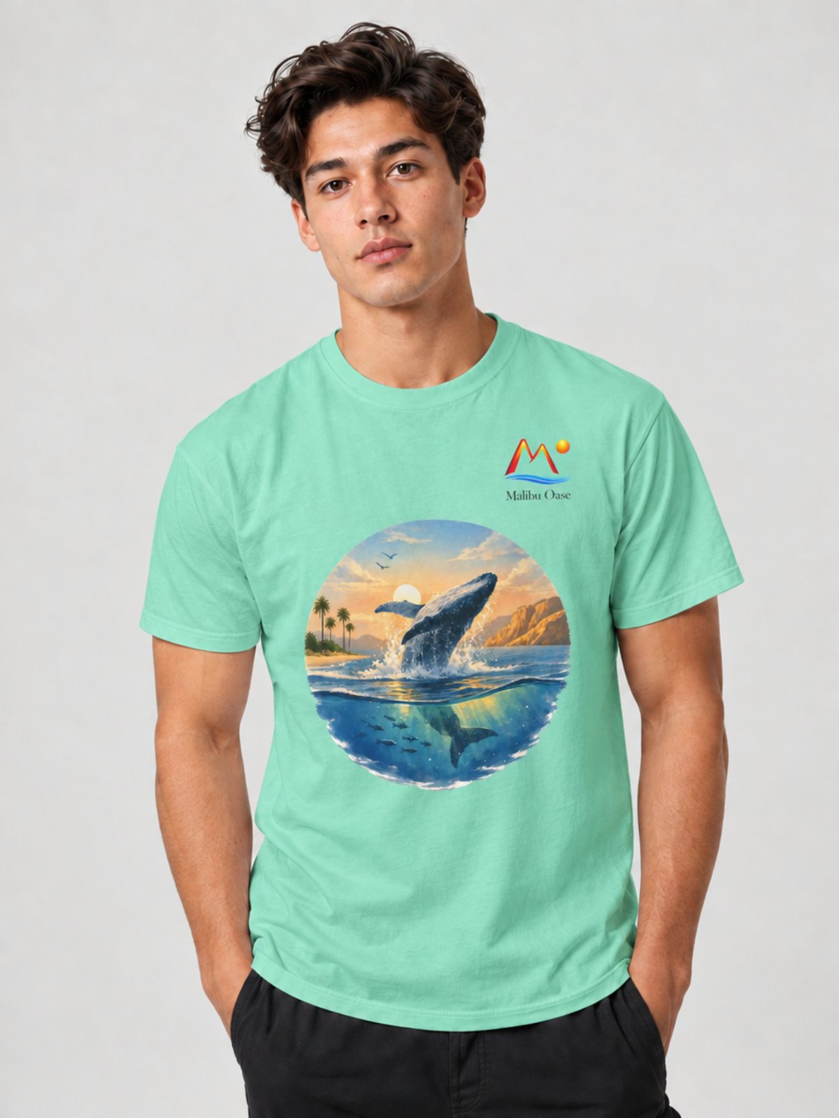 Island Reef. Man wearing breaching whale T-shirt with logo.