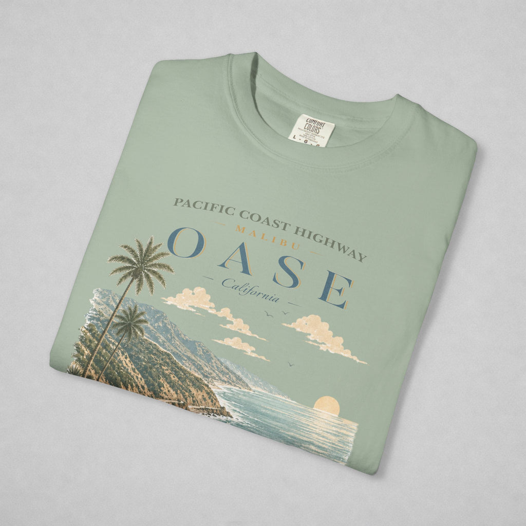 Folded Bay T-shirt with text "Malibu OASE"