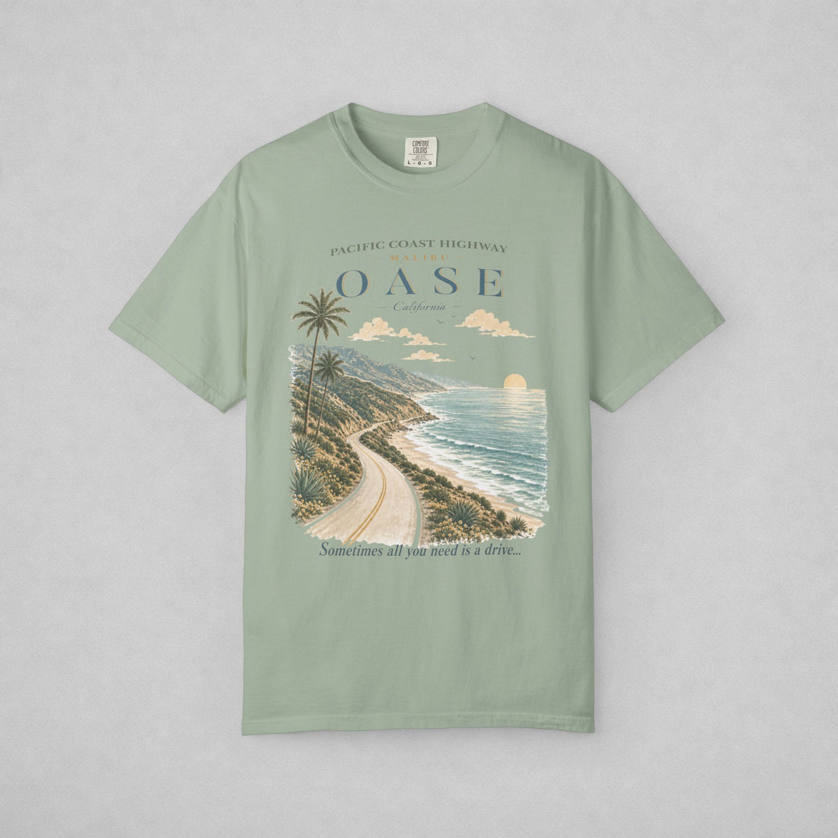 Bay T-shirt with scenic view of Pacific Coast Highway.  Caption: "Sometimes all you need is a drive..."