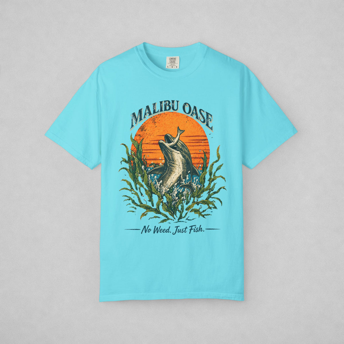 Lagoon Blue T-shirt with a dolphin grabbing a fish.  Caption: No Weed. Just Fish.