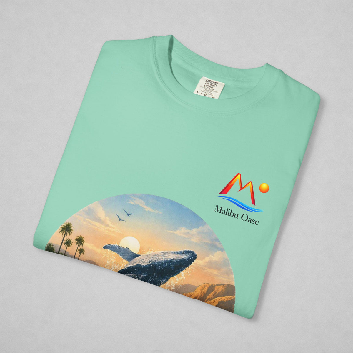 Folded Island Reef T-shirt with breaching whale and logo.